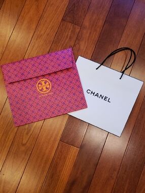 Tory Burch and Chanel shopping bags, empty